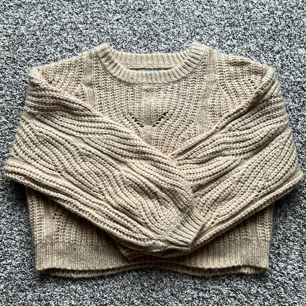 Cropped cable knit bishop sleeve sweater